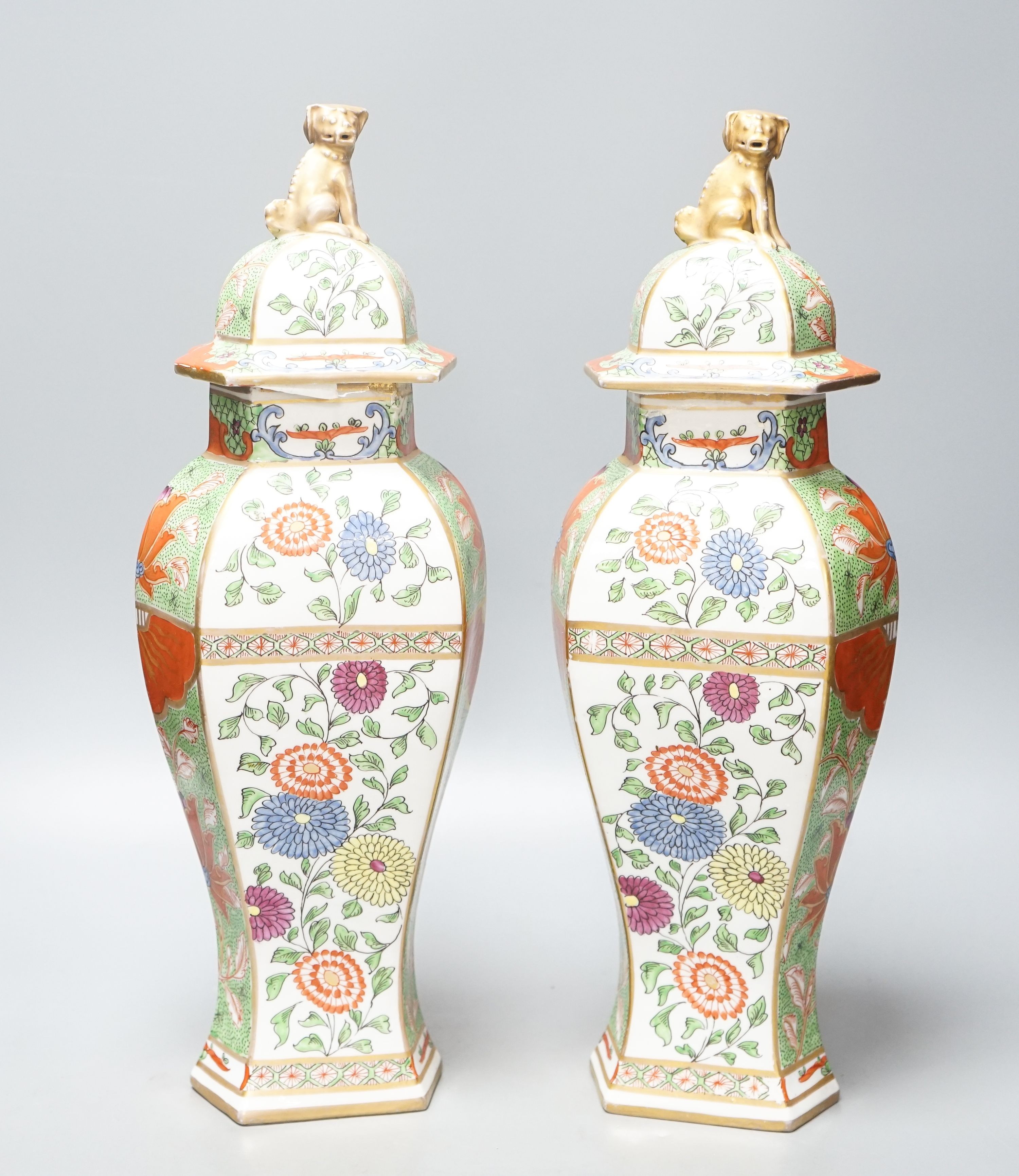 A pair of Samson kakiemon style lidded hexagonal baluster vases 41cm
